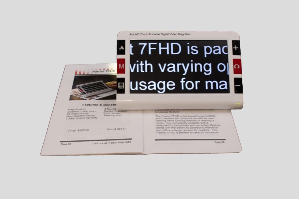 A magnifier enlarges text on an open book, highlighting small print clearly.