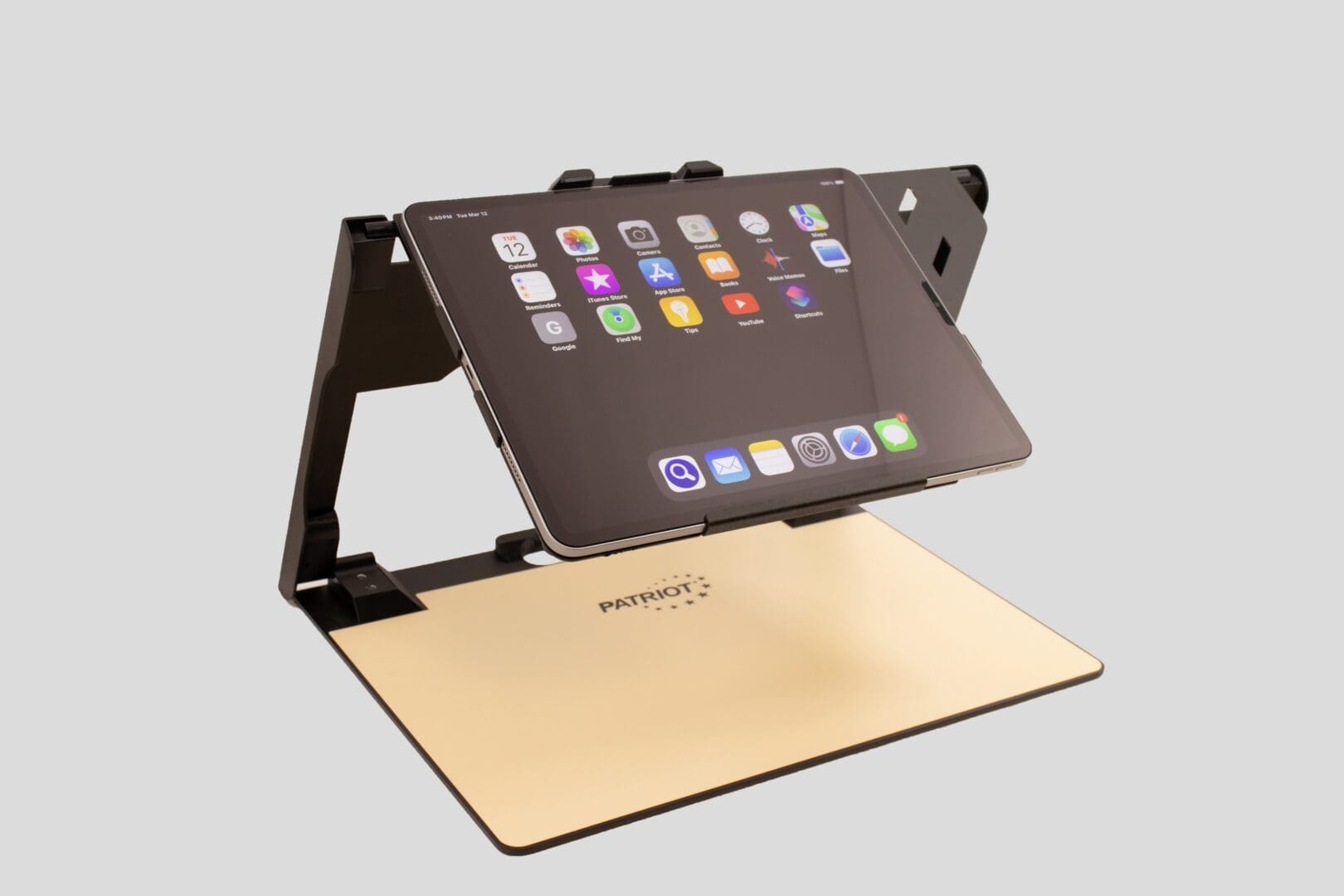 Adjustable tablet stand holding a tablet at an angle.