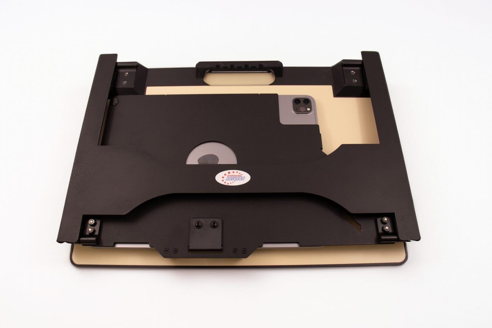 Black and beige device or component with a handle and cutouts.