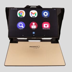 Tablet in a gold case displaying app icons on the screen.